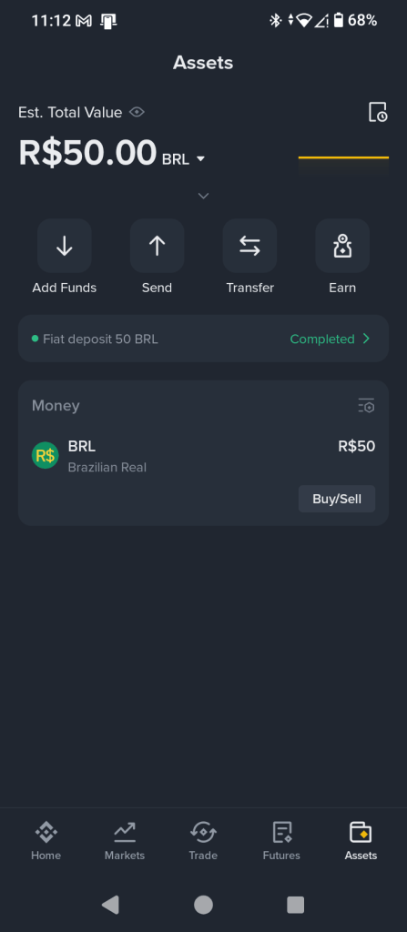 Binance wallet asset screen displaying successful R$50 BRL fiat deposit and total portfolio value